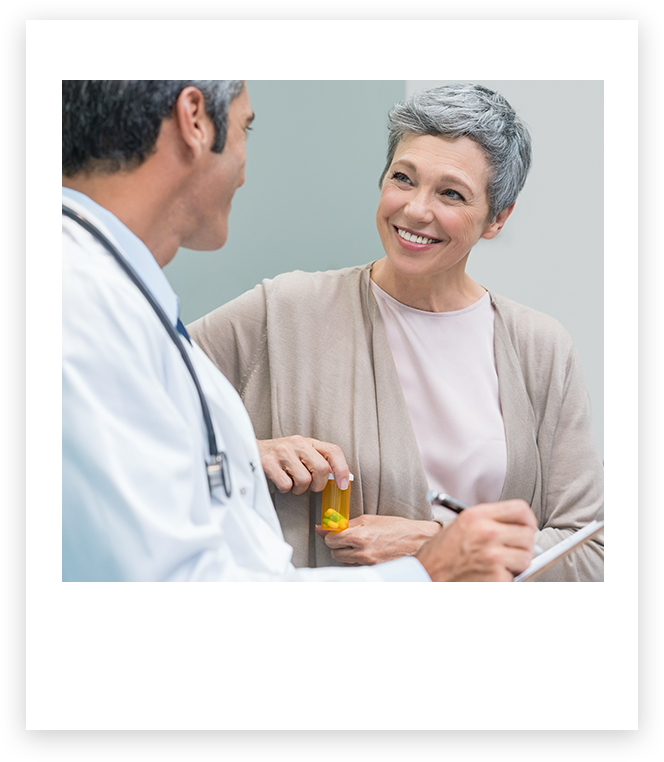 Doctor speaking with smiling patient speaking